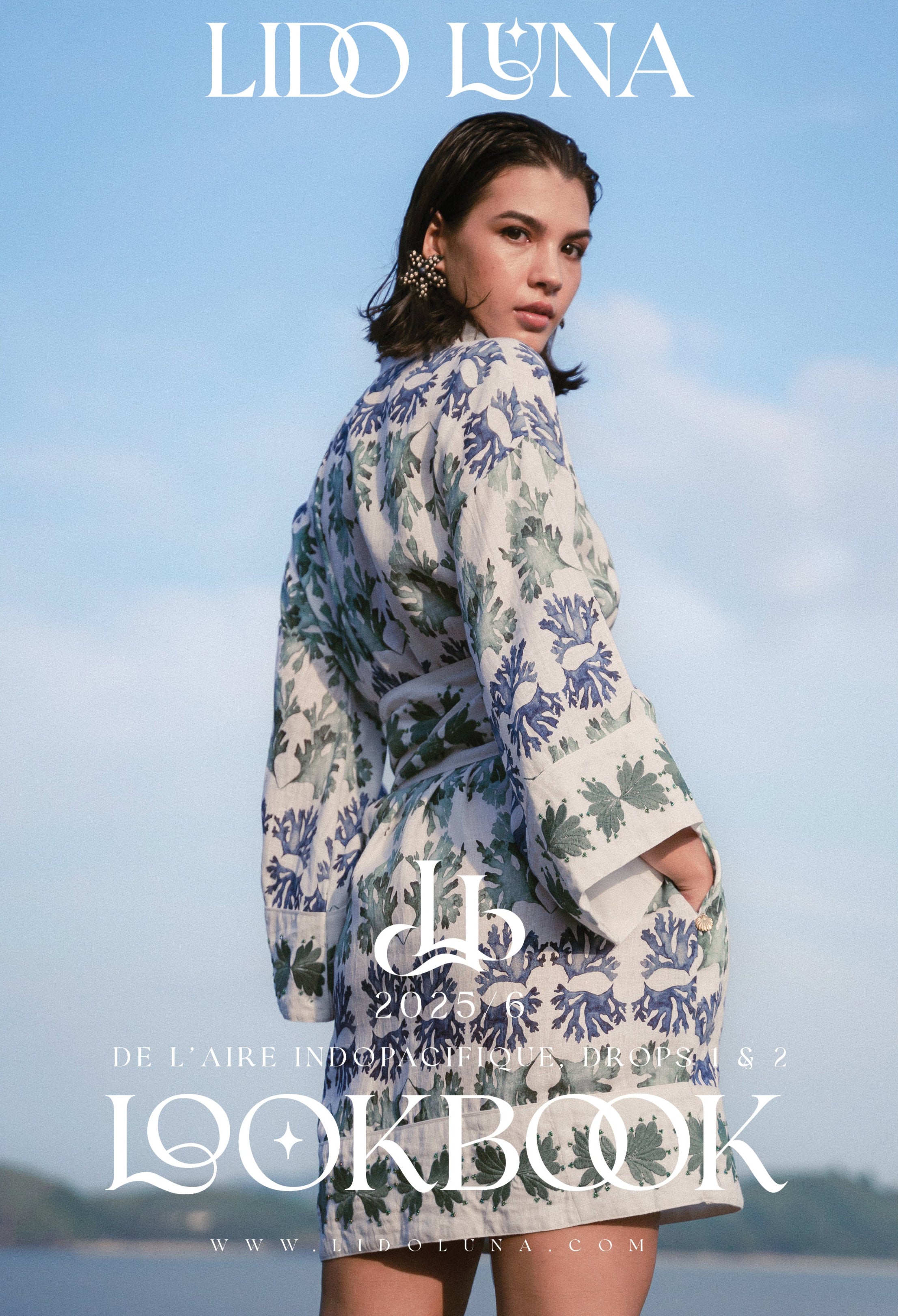 Woman wearing a custom print with seaweed image by Fleur Kakasi,  with Lido Luna branding on a blue sky background, photographed on location in Lombok, Indonesia
