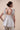 Beautiful Linen Babydoll Top with beading and embroidery designed by Fleur Kakasi.  Shoulder tie straps, adjustable fitting, and real freshwater pearl trim. 