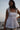 Beautiful Linen Babydoll Top with beading and embroidery designed by Fleur Kakasi.  Shoulder tie straps, adjustable fitting, and real freshwater pearl trim. 