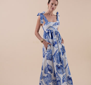 Beautiful pure linen empire line maxi dress in custom print by Fleur Kakasi.  Adjustable fit, luxurious real freshwater pearl trim & embroidery. 