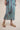 Beautiful luxurious pure silk slip dress gown in teal green with seashell and seaweed artwork designed by Fleur Kakasi.  Adjustable straps, mid-length. 