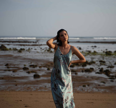 Beautiful luxurious pure silk slip dress gown in teal green with seashell and seaweed artwork designed by Fleur Kakasi.  Adjustable straps, mid-length. 