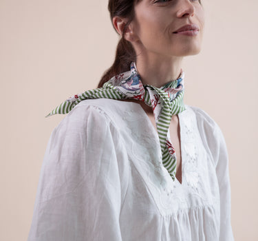 The Koi Carré scarf is a beautiful 100% silk twill square scarf.  Can worn as a headscarf, hair ribbon, on the wrist, or on your bag handle.