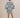 The Nerites dress is a short, popover style in 100% linen in a traditional but modernised kaftan style, with deep placket neckline and wide bell sleeves. Custom print by Fleur Kakasi, with hand embroidery and beading on the cuffs, hem, and double-length belt.