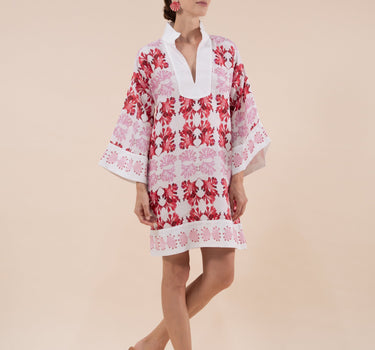 The Nerites dress is a short, popover style in 100% linen in a traditional but modernised kaftan style, with deep placket neckline and wide bell sleeves. Custom print by Fleur Kakasi, with hand embroidery and beading on the cuffs, hem, and double-length belt.
