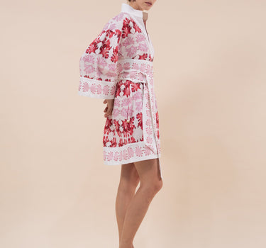 The Nerites dress is a short, popover style in 100% linen in a traditional but modernised kaftan style, with deep placket neckline and wide bell sleeves. Custom print by Fleur Kakasi, with hand embroidery and beading on the cuffs, hem, and double-length belt.