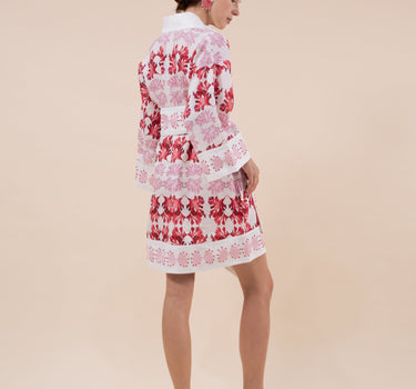 The Nerites dress is a short, popover style in 100% linen in a traditional but modernised kaftan style, with deep placket neckline and wide bell sleeves. Custom print by Fleur Kakasi, with hand embroidery and beading on the cuffs, hem, and double-length belt.