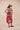 The Poseidon Wrap Skirt is a classic full-wrap style, below knee length, featuring extra long ties, and stunning applique and embroidery details on coral red linen. 
 The contrasting ivory applique features our signature coral motif, with glass pearl beads, and each tie features real natural baroque pearl charms at each end. Design by Fleur Kakasi