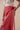 The Poseidon Wrap Skirt is a classic full-wrap style, below knee length, featuring extra long ties, and stunning applique and embroidery details on coral red linen. 
 The contrasting ivory applique features our signature coral motif, with glass pearl beads, and each tie features real natural baroque pearl charms at each end. Design by Fleur Kakasi