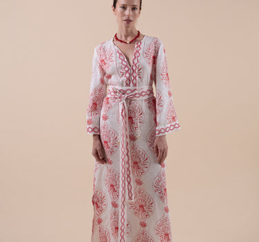 The Venus Kaftan is composed of 100% European Linen, with custom print, and hand embroidery to the cuffs, neckline and hem.  Included is a beautifully embroidered belt that is able to be double-wrapped and features real natural baroque pearl trim.Design by Fleur Kakasi. 