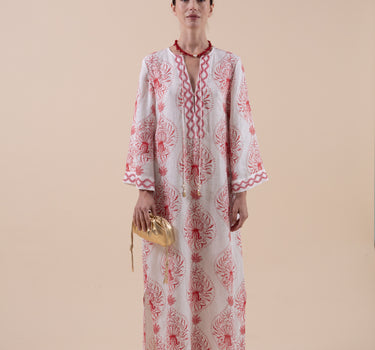 The Venus Kaftan is composed of 100% European Linen, with custom print, and hand embroidery to the cuffs, neckline and hem.  Included is a beautifully embroidered belt that is able to be double-wrapped and features real natural baroque pearl trim. Design by Fleur Kakasi. 