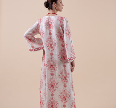 The Venus Kaftan is composed of 100% European Linen, with custom print, and hand embroidery to the cuffs, neckline and hem.  Included is a beautifully embroidered belt that is able to be double-wrapped and features real natural baroque pearl trim.Design by Fleur Kakasi. 